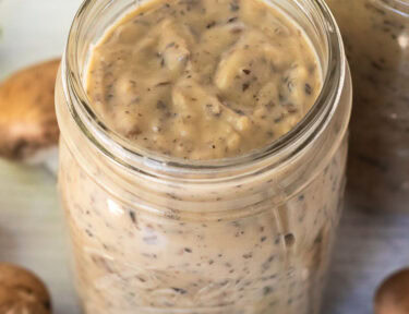 Glass jar of Condensed Cream of Mushroom Soup.