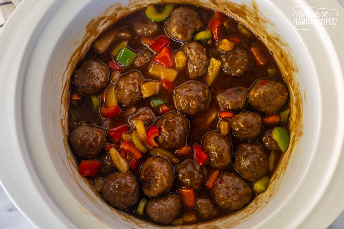 Crock pot of sweet and sour meatballs.