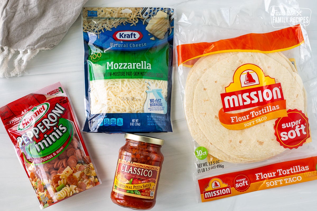 Ingredients to make an easy Pizzadilla recipe including mozzarella cheese, flour tortillas, mini pepperoni and pizza sauce.