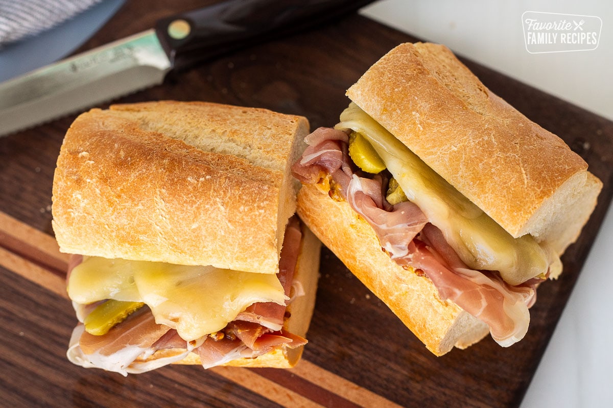 Cut in half Raclette sandwich on French baguette.