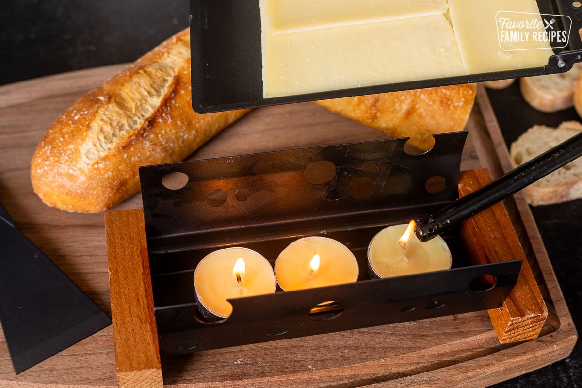 Lighting candles on Raclette dish.