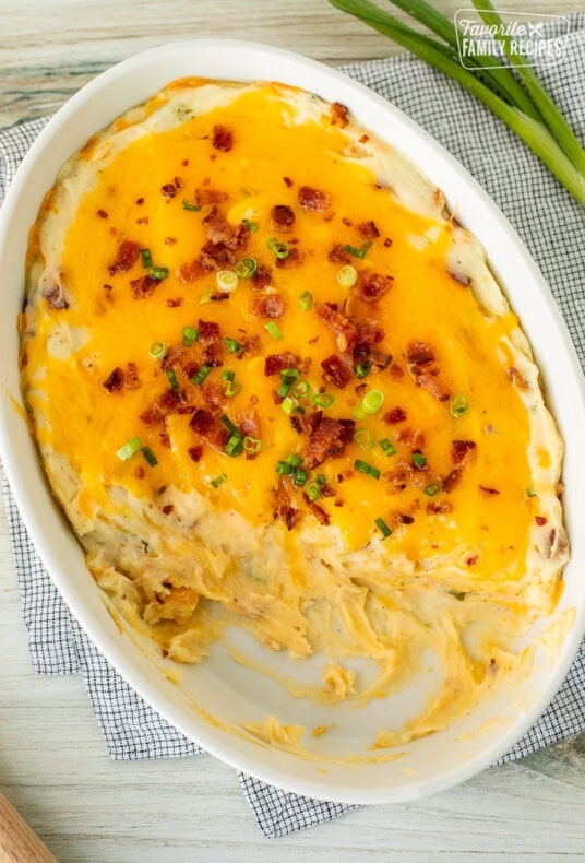 Scooped out Loaded Mashed Potatoes from a casserole dish.