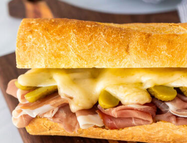 Raclette sandwich on a piece of French baguette.