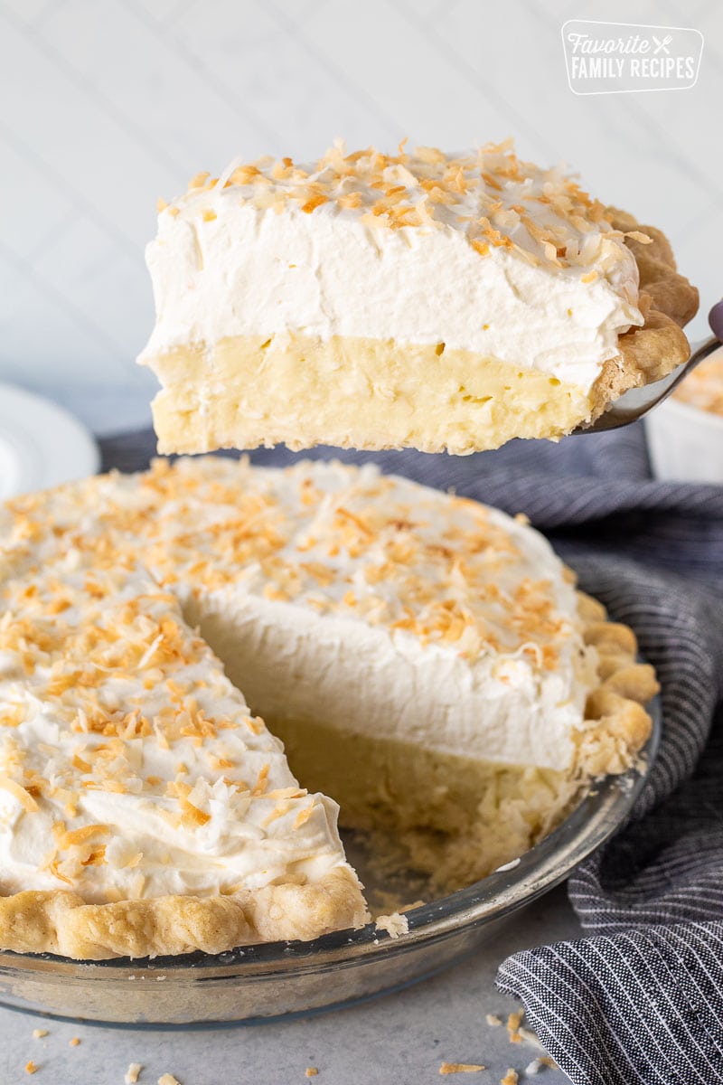 Spatula holding up a slice of Coconut Cream Pie.