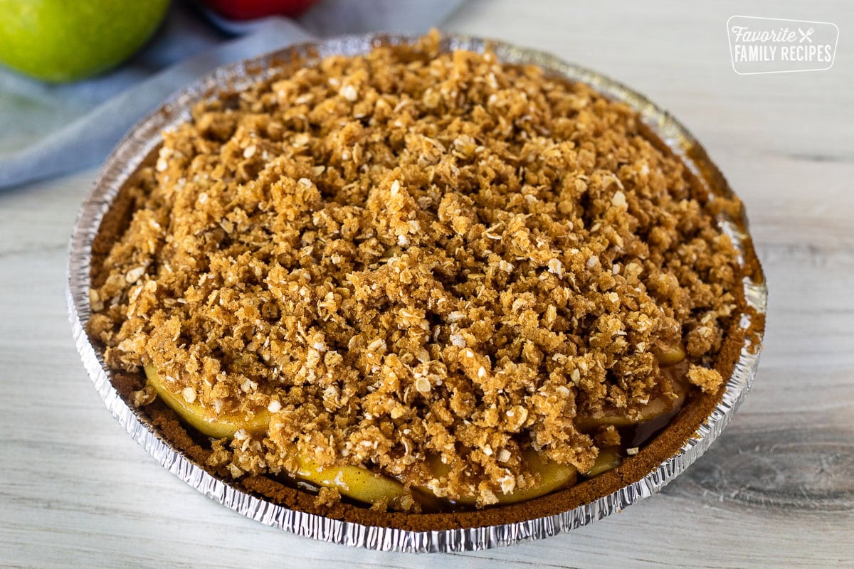 Crumble topping on unbaked Gluten Free Apple Pie.