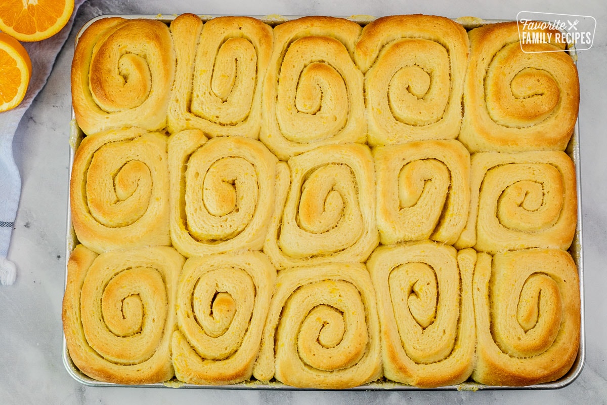 Homemade rolls in a baking sheet.