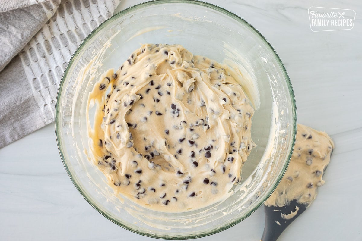 Mixing bowl with Chocolate Chip Cheese Ball mixture. Spatula on the side.