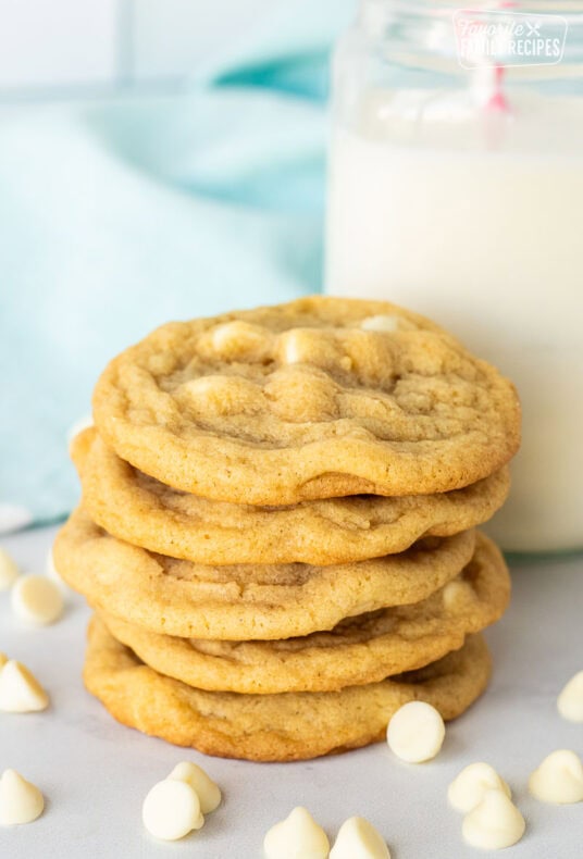 Stack of Vanilla Cookies next to a glass of milk.