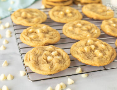 Homemade White Chocolate Chip Cookies just out of the oven and cooling on a cooling rack