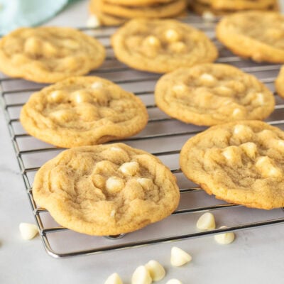 Homemade White Chocolate Chip Cookies just out of the oven and cooling on a cooling rack