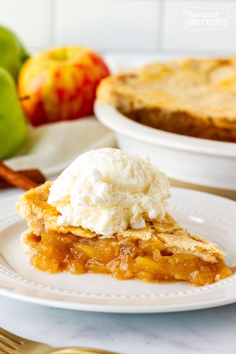 Plate of Homemade Apple Pie topped with vanilla ice cream.