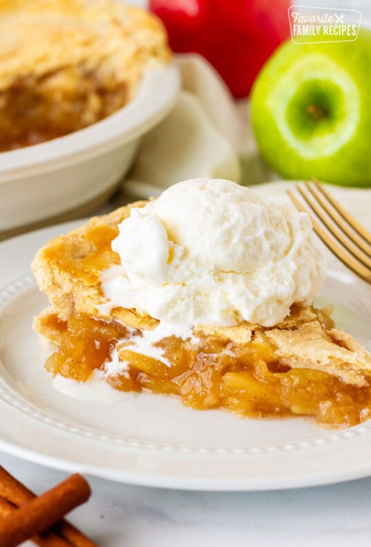 Close up of Homemade Apple Pie with melting vanilla ice cream.