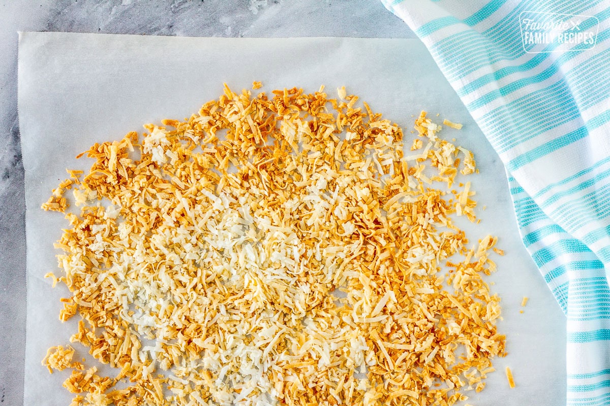 Toasted coconut on parchment paper.