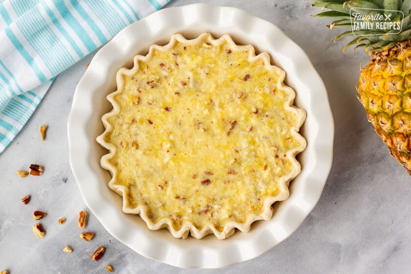 Unbaked Island Pecan Pie in a baking dish.