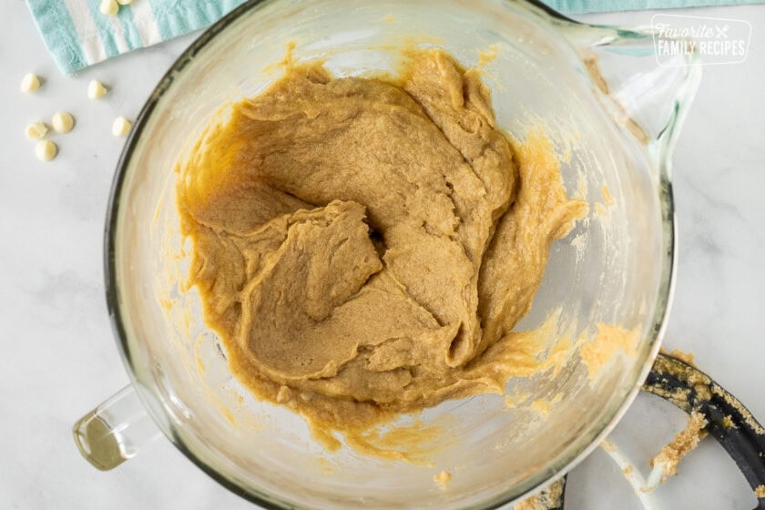 Mixing bowl with Vanilla cookie dough with eggs.