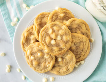 Top view of Vanilla Cookies on a plate with a glass of milk.