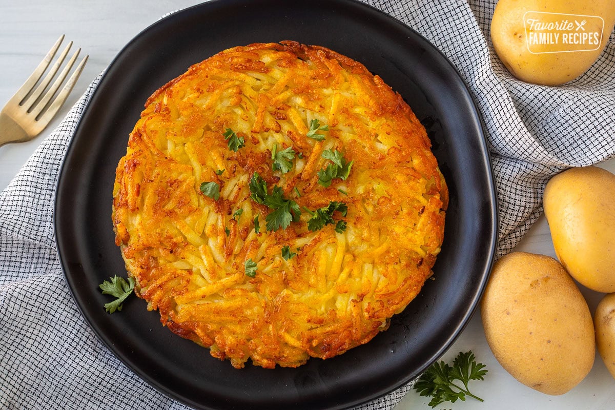 Rosti on a plate garnished with parsley.