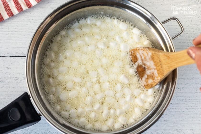 Saucepan with melted marshmallows and pineapple juice.