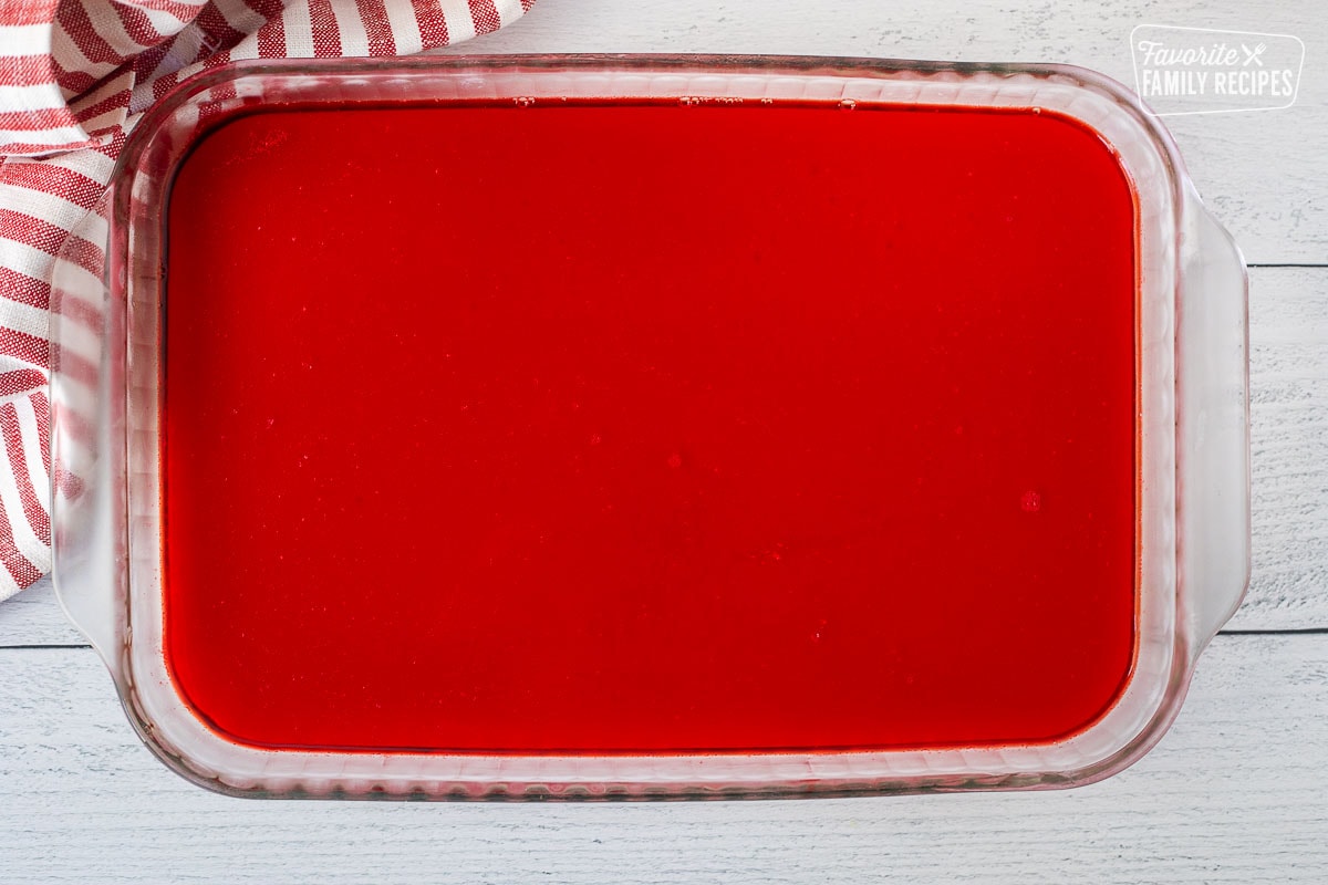 Red Jell-O layer in glass dish.