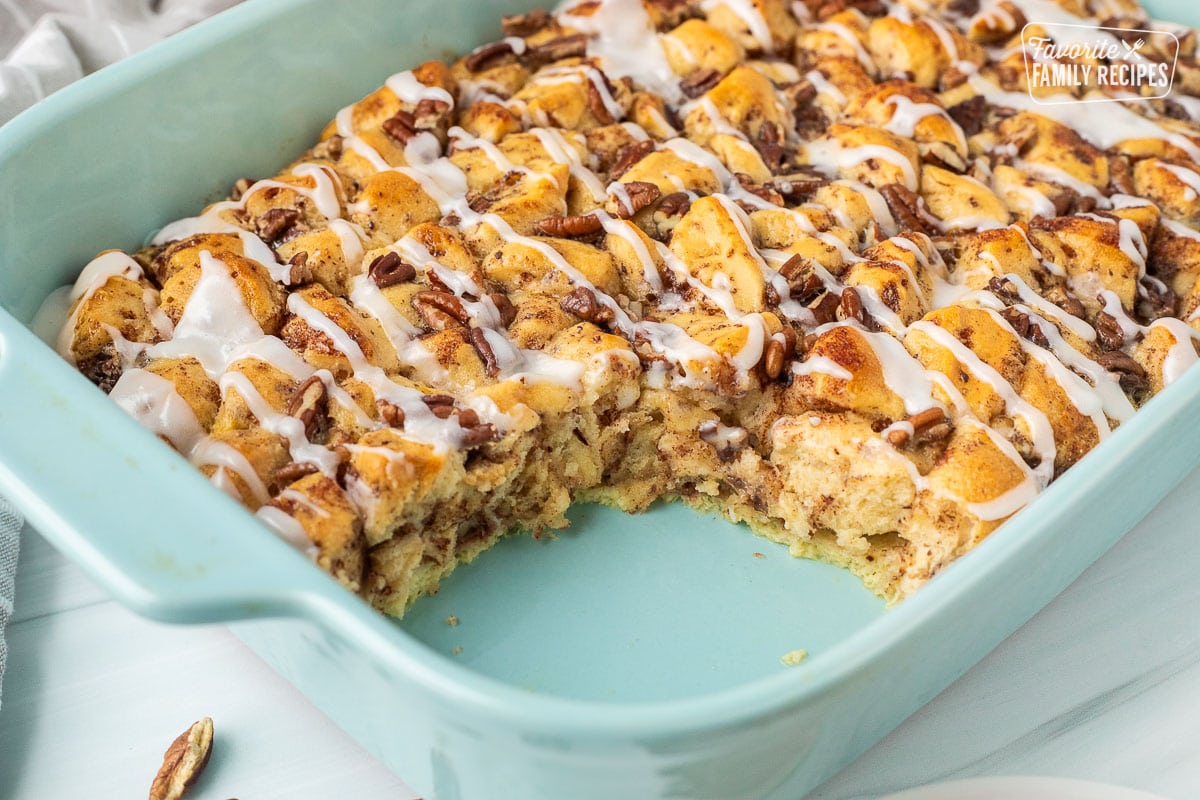 Baking dish of Cinnamon Roll Casserole missing a corner serving.