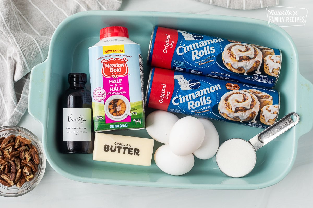 Ingredients to make Cinnamon Roll Casserole including to Kansas cinnamon rolls, sugar, eggs, half-and-half, butter, vanilla and pecans.