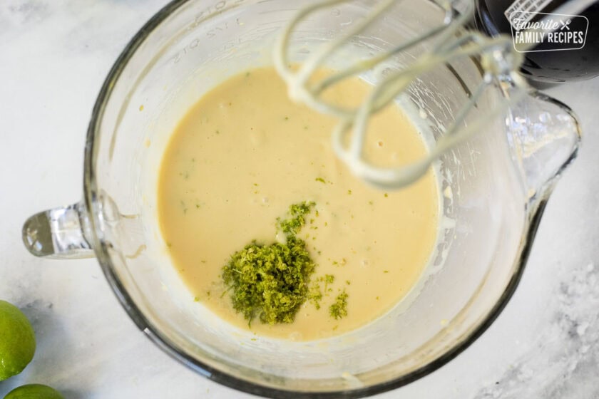 Key lime pie filling being mixed with electric beaters