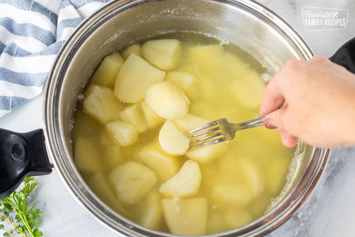 For piercing into cooked potato in a pot of hot water.