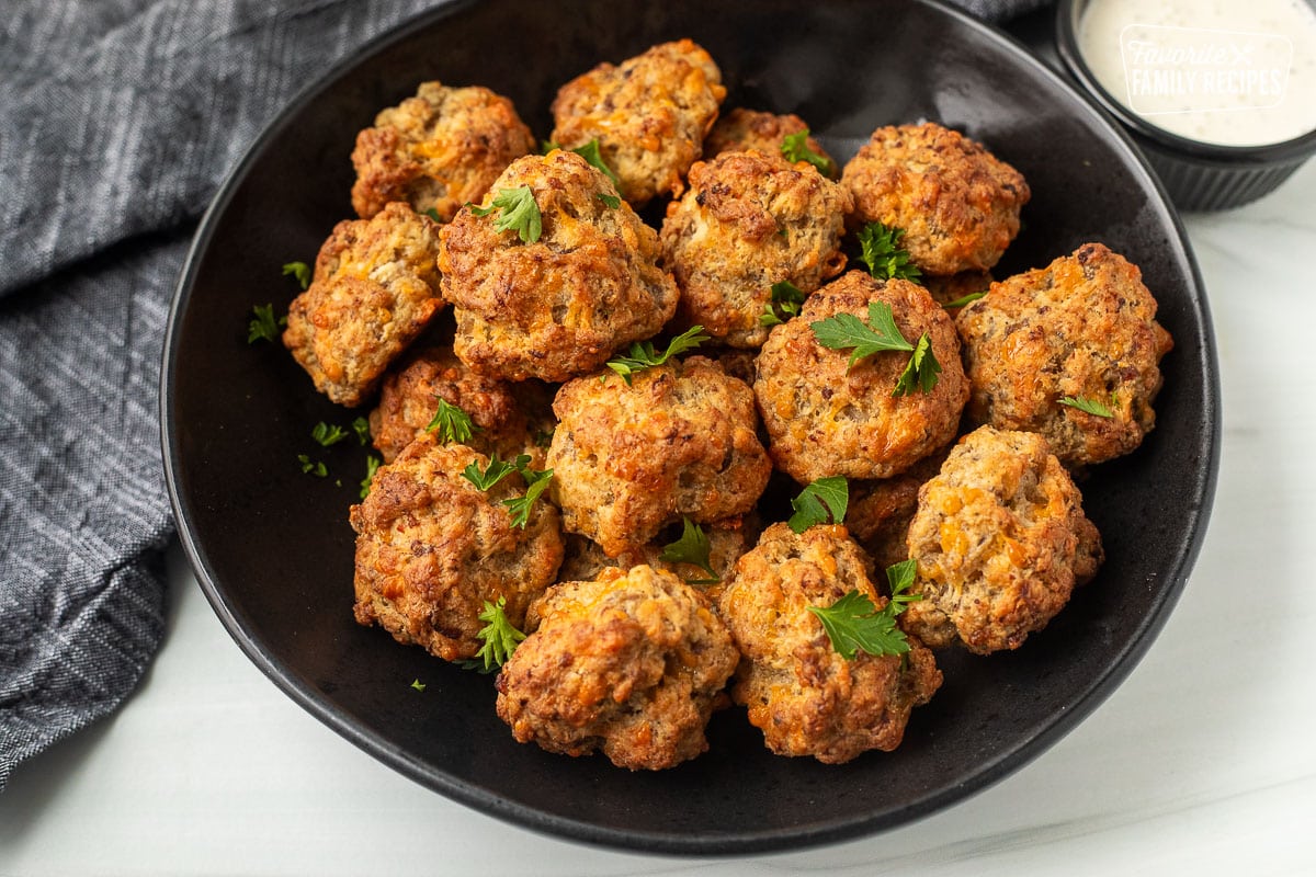 Bowl of Red Lobster Sausage Balls garnished with parsley.