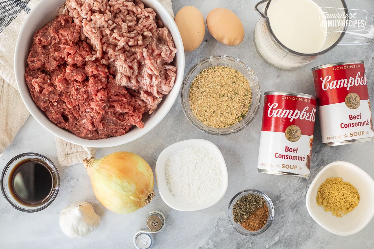 Ingredients to make Crock Pot Swedish Meatballs including ground beef, ground pork, beef consumme, heavy cream, seasoning, onion, garlic, worchester sauce, seasonings, eggs, salt, pepper, corn starch and ground mustard.