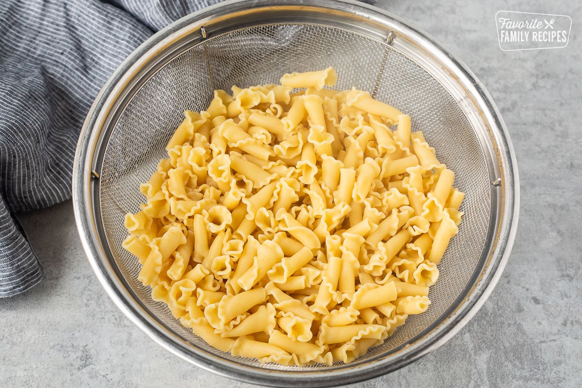 Colander with fresh cooked pasta.