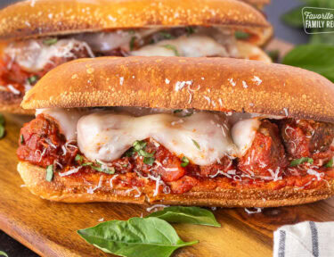 Meatball Sandwich with melted cheese on a toasted roll.