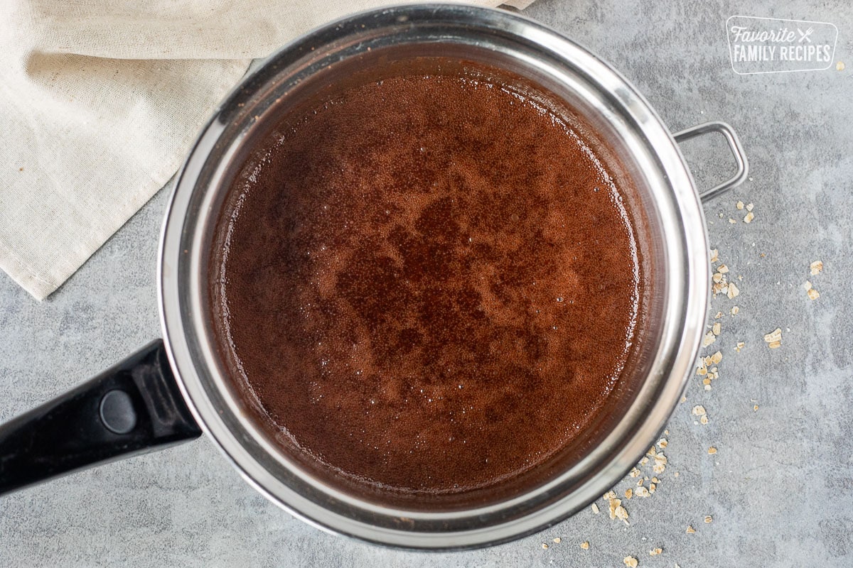 Saucepan with boiling chocolate mixture.