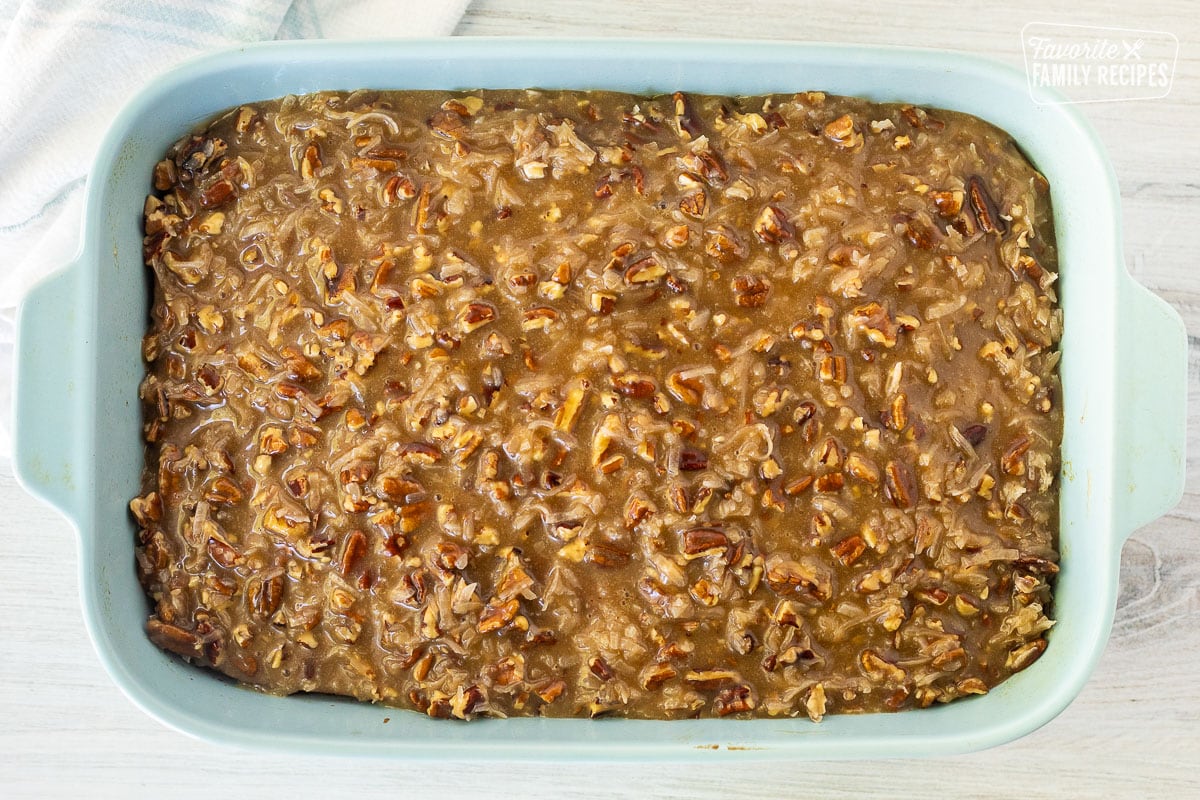 Oatmeal Cake covered with pecan caramel topping in a baking dish.