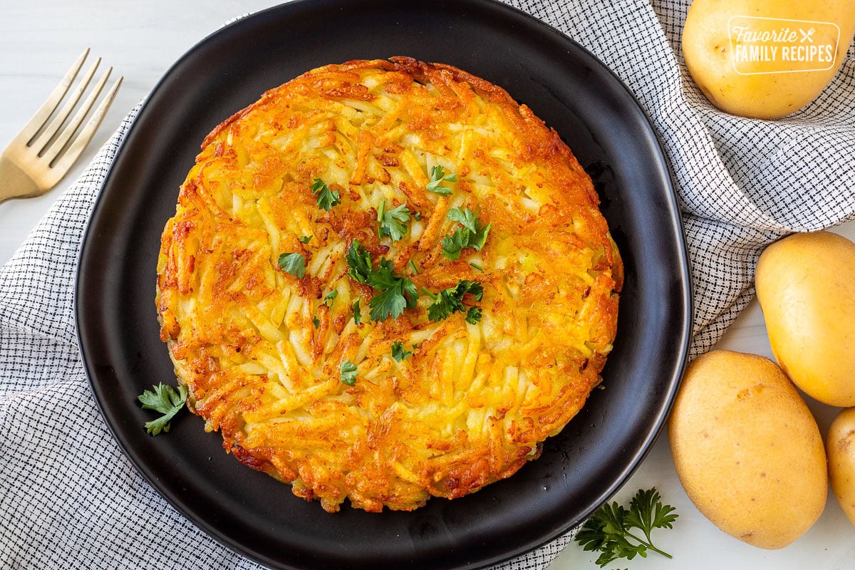 Rosti on a plate garnished with parsley.