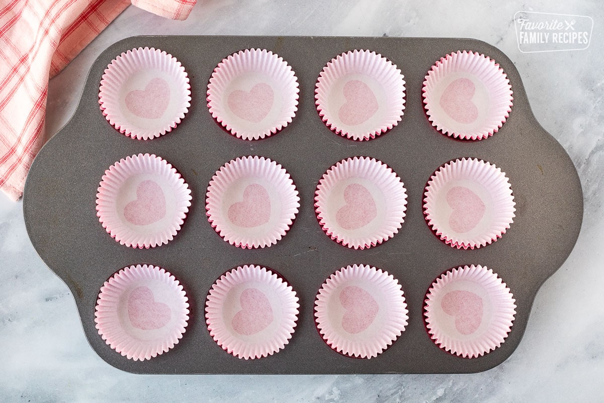 Mini cupcake liners in a muffin baking pan.