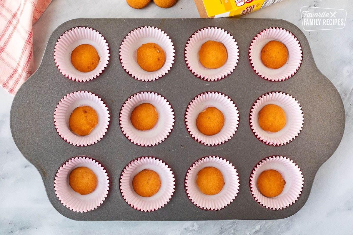 Nilla wafers in the bottom of mini cupcake liners.