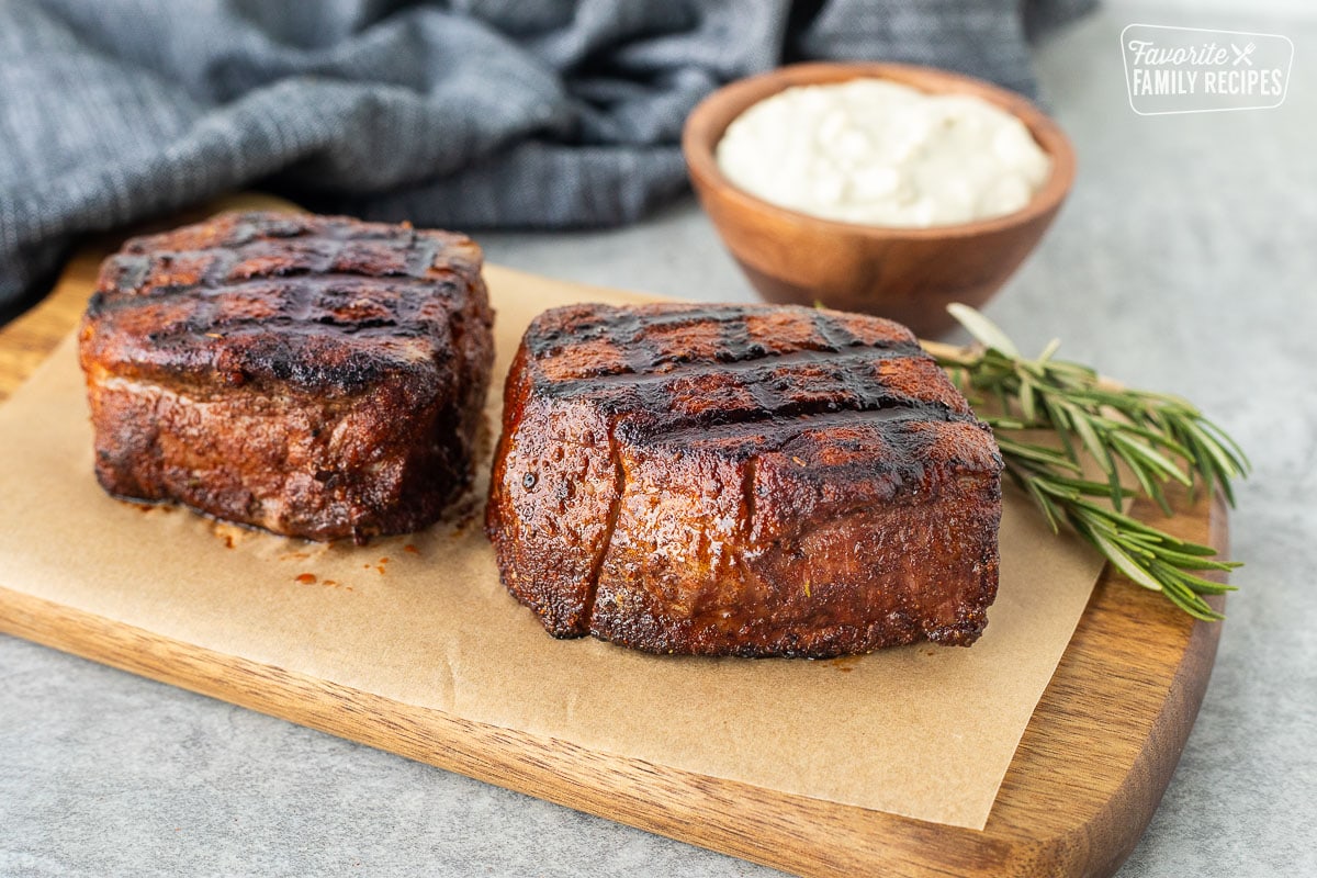 Two Grilled Filet Mignon with Blue Cheese sauce in a bowl.