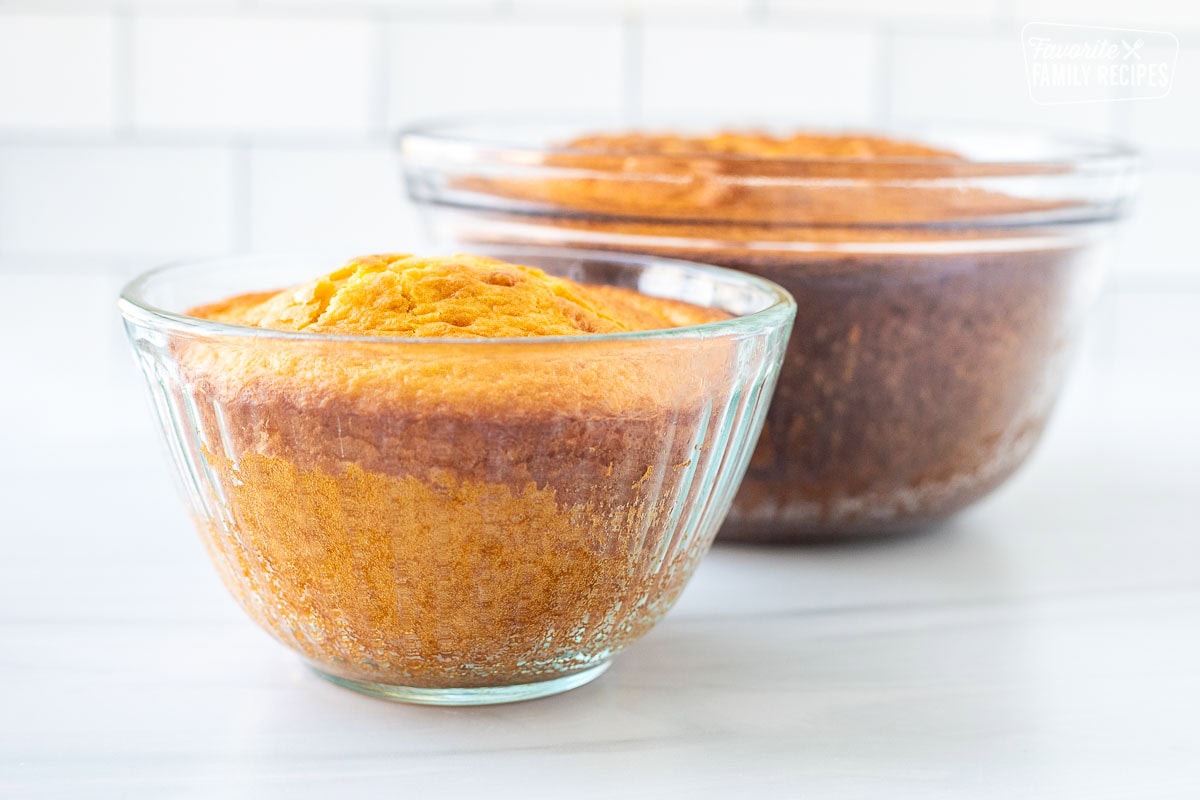 Two glass bowls with baked cake.