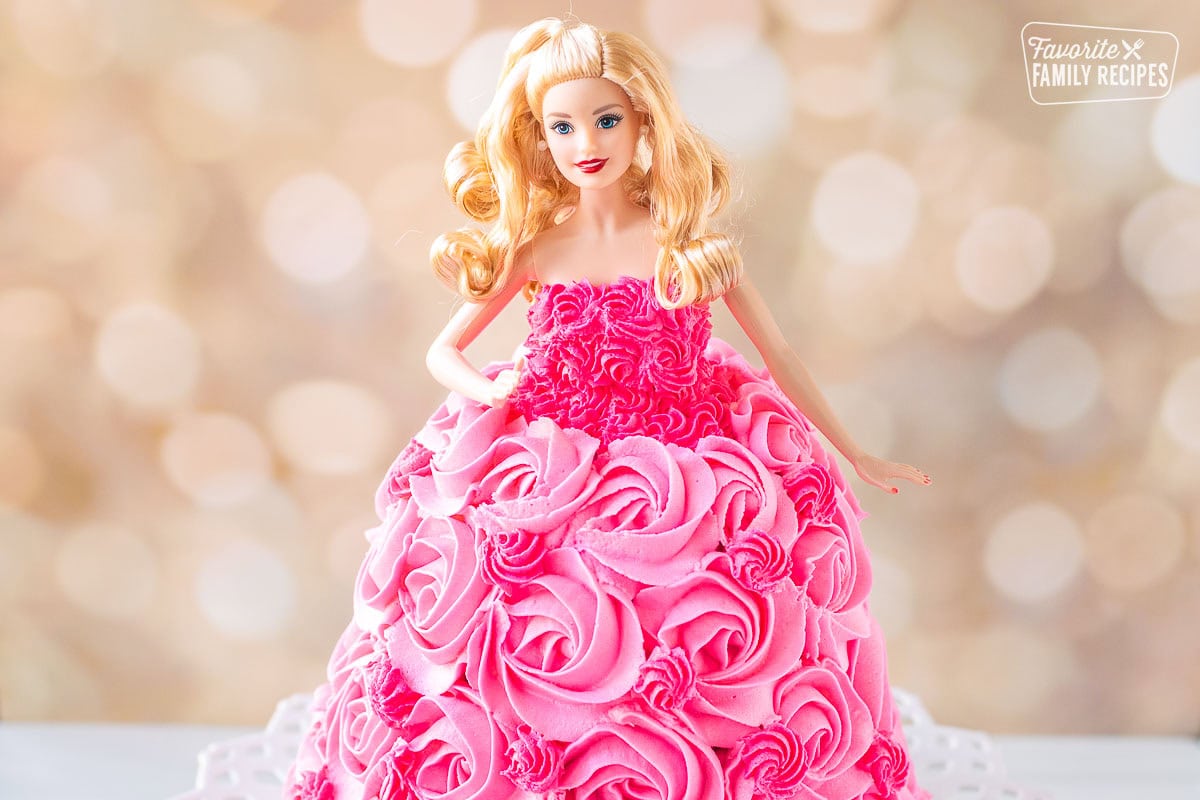 Barbie cake decorated with a pink frosting dress.