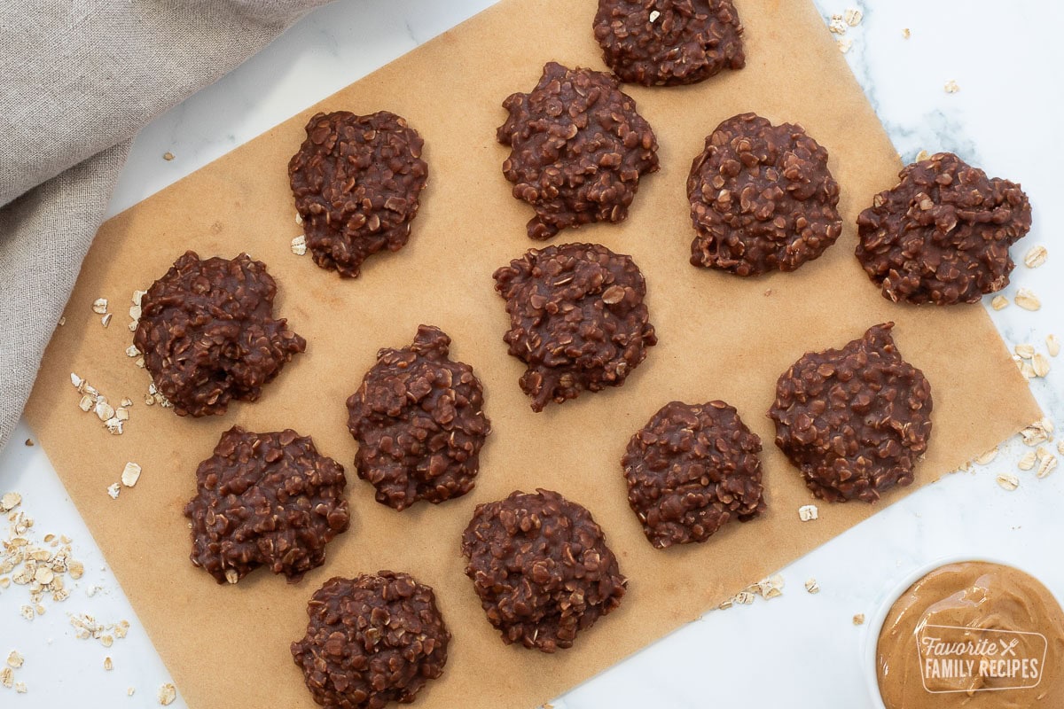 Chocolate no bake cookies cooling on a sheet of brown parchment paper