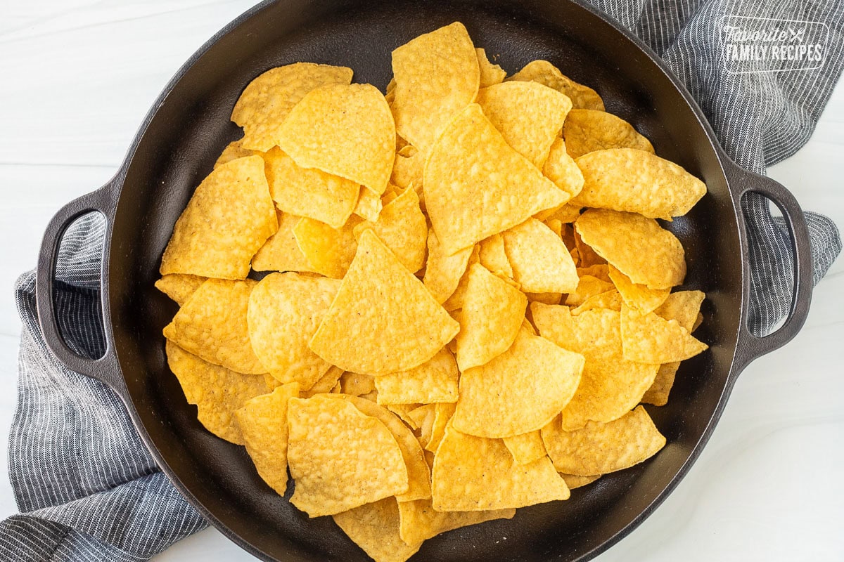 Large skillet with tortilla chips.