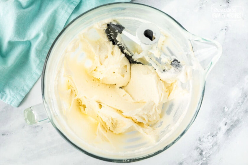 Creamed butter and sugar for Easter cupcakes in a glass mixing bowl.