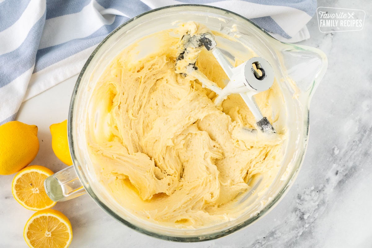 Glass mixing bowl with lemon poundcake batter.