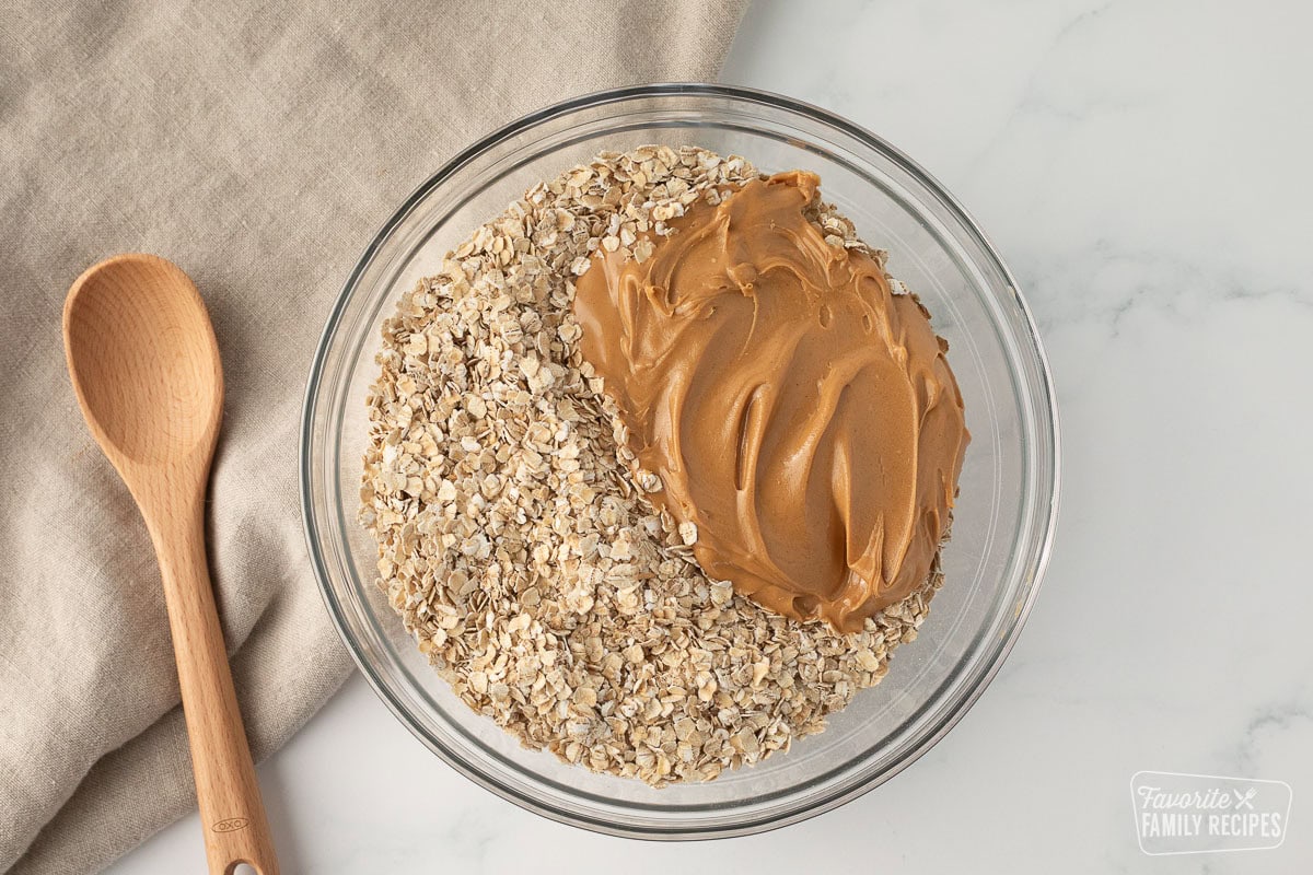 A bowl of oats and peanut butter to make no bake cookies