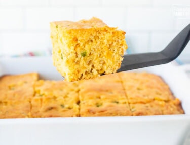 Slice of Mexican cornbread on a spatula.