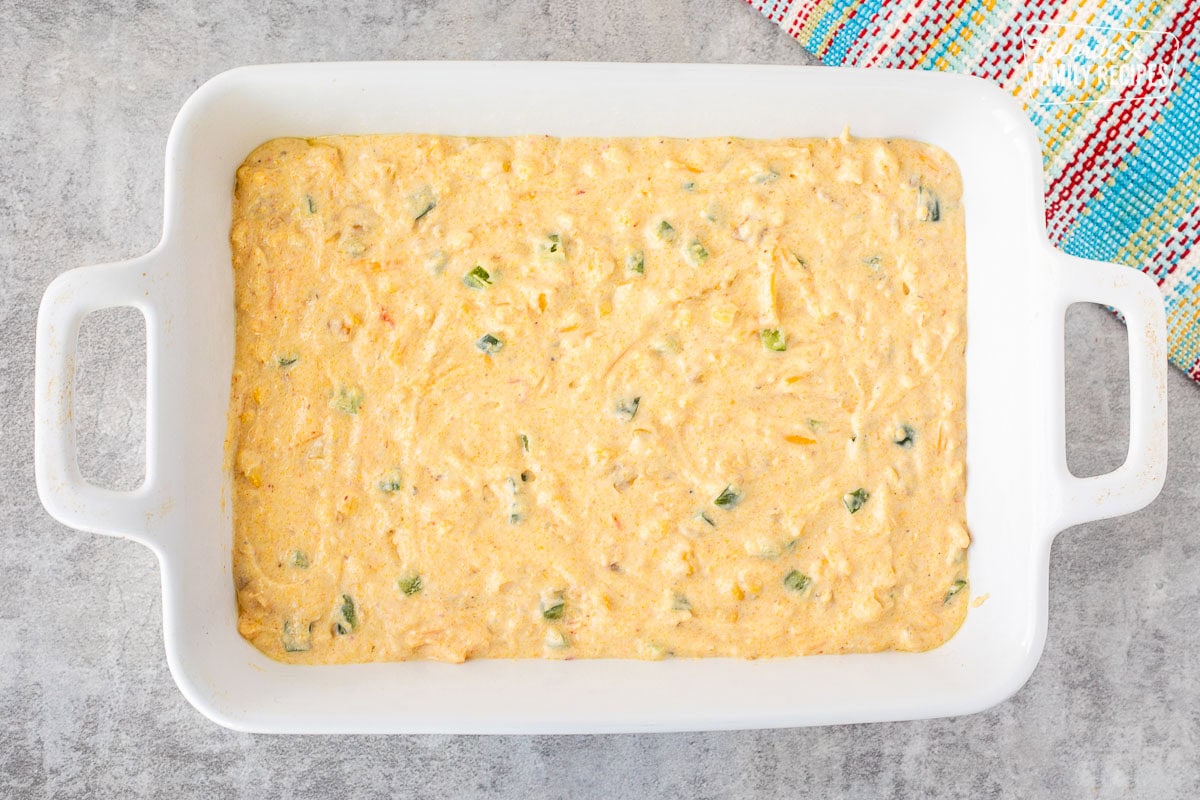 Casserole baking dish with Mexican cornbread unbaked.