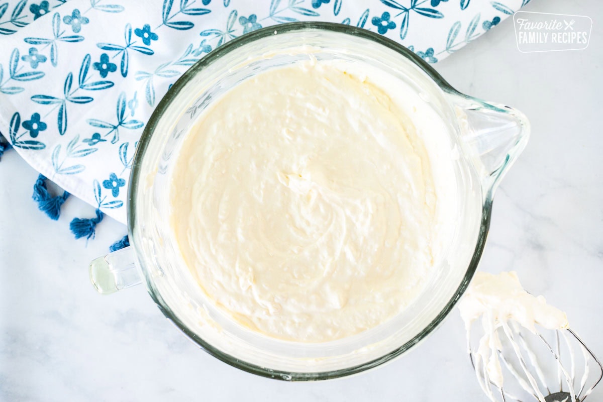 Glass mixing bowl with pineapple whipped topping.