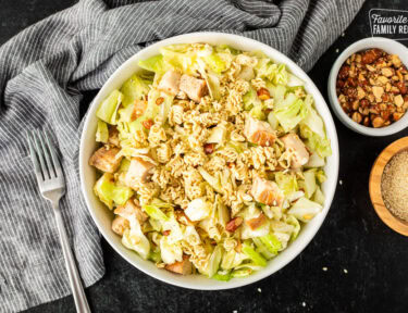 Bowl of Ramen Noodle Salad (Pai Mai topped with almonds, sesame seeds and season toasted ramen noodles.