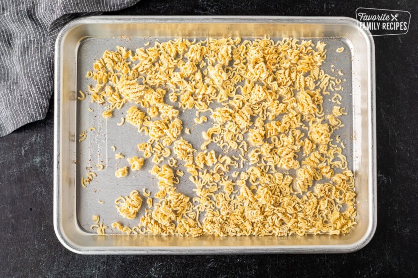 Toasted Ramen noodles with seasoning on a pan.