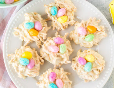 White Chocolate Bird Nests on a plate with jellybeans and peeps.